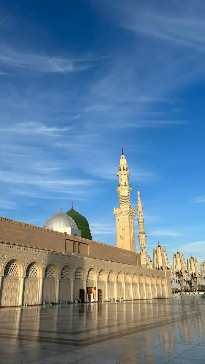a large building with a clock tower in the background